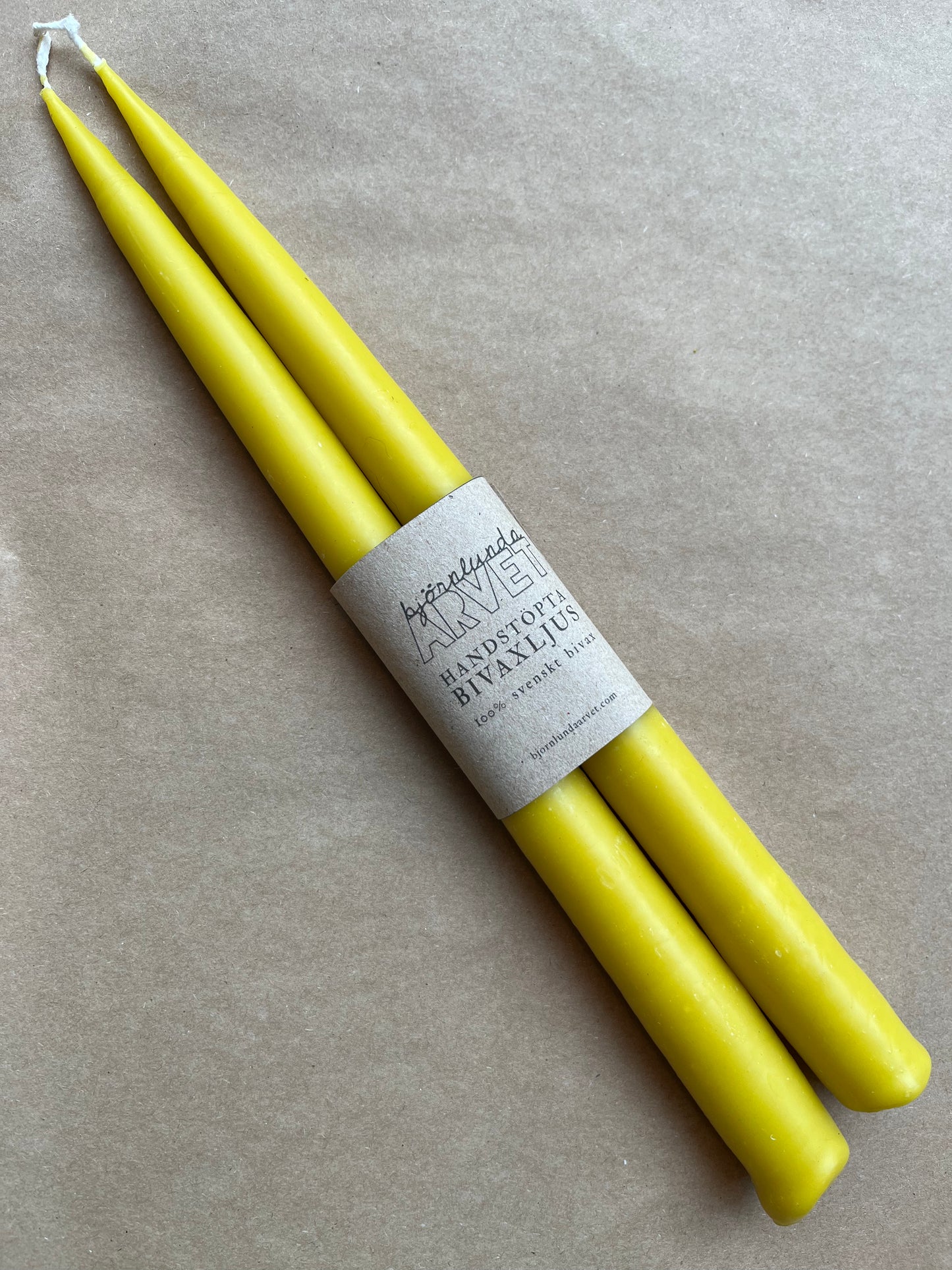 A bare beeswax candle Honey